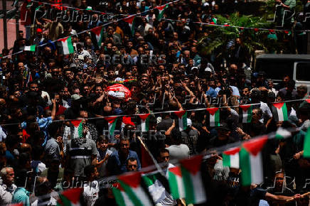 Mourners take part in the funeral of of Sayfollah Kamel Musallet, killed amid the Israel-Gaza conflict, near Ramallah