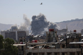 Smoke rises after strikes on Syria's defense ministry in Damascus
