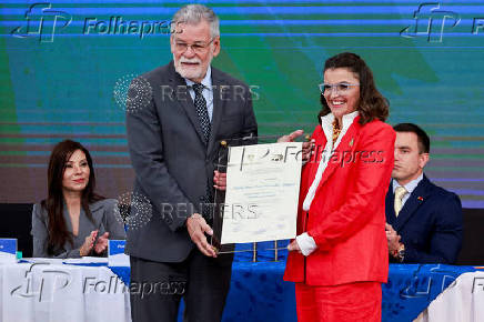 Ecuador's re-elected President Daniel Noboa receives the certificate of election winner during an event at the National Electoral Council, in Quito