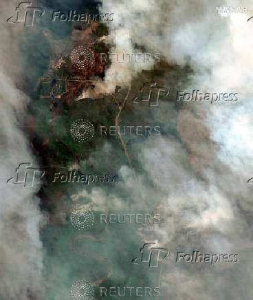 A satellite image shows smoke rising from Shoe Fire burning near Little Bear Lake, in Saskatchewan