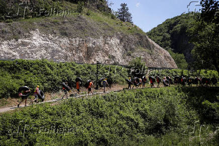 Sports enthusiasts compete while floating on inner tyre tubes during the tyre festival 'Bunar Fest' in Prizren