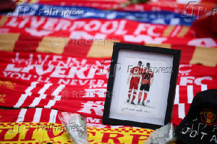 Fans pay their respects to late soccer player Diogo Jota, at Anfield Stadium in Liverpool