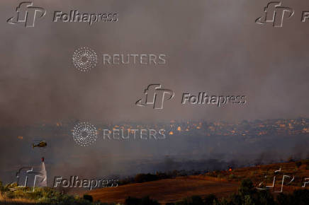 A wildfire burns on the outskirts of Valmojado