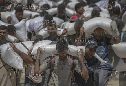Aid enters Gaza Strip after Israel announces daily pause of hostilities