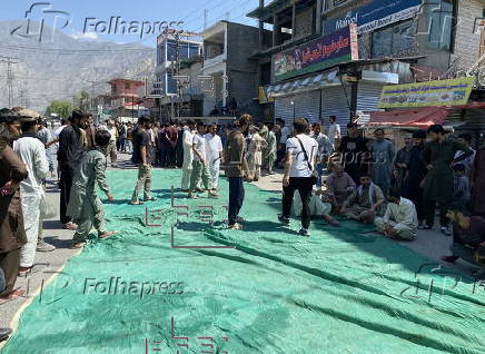Mass funeral of 8 volunteers killed in a landslide near the Chinese border in Gilgit