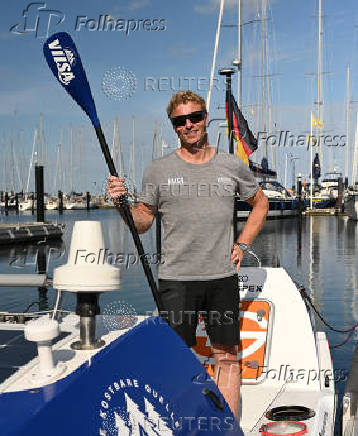 German stand-up paddler Michael Walther takes to the Baltic Sea for a test run in Kiel