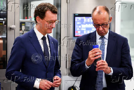 German Chancellor Friedrich Merz visits a battery cell production facility in Muenster
