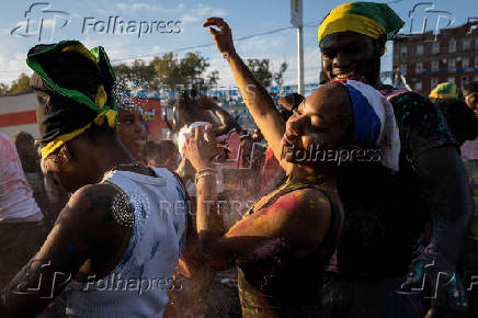 Revelers attend J'ouvert celebration on the day of the annual West Indian Day parade in the Brooklyn borough of New York