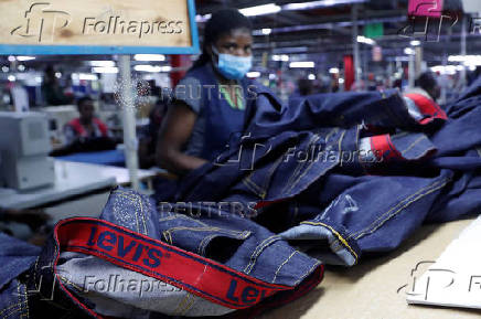 Kenyan workers prepare clothes for export at the United Aryan EPZ factory in Ruaraka district of Nairobi