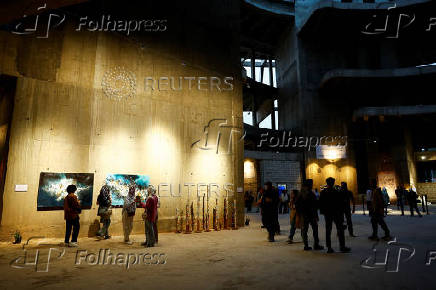 Visitors walk through the
