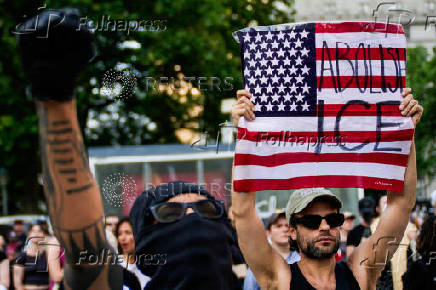 People protest against federal immigration sweeps, near the U.S. immigration court at the Jacob K. Javits Federal Building, in New York