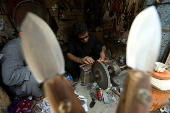 Blacksmiths sharpen blades for flagellation ahead of Ashura in Peshawar