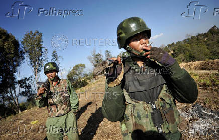 Soldiers of Kachin Independence Army (KIA) man their position at front line near Mai Ja Yang in Kachin state