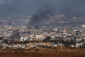 Smoke rises from northern Gaza, as seen from the Israeli side of the Israel-Gaza border