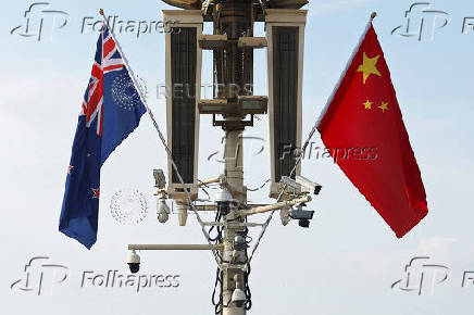 Flags of New Zealand and China flutter in Beijing