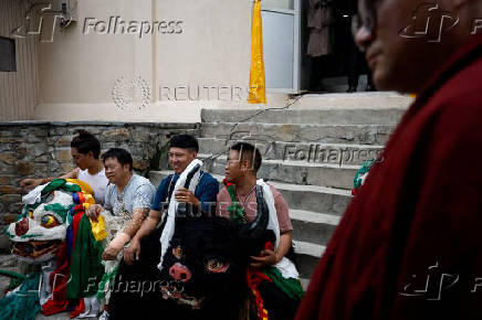 Tibetans mark the 90th birthday celebration of their spiritual leader, the Dalai Lama, at Jawalakhel Handicraft Center in Lalitpur