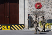 Military personnel stand guard outside the Turkish Presidency's Dolmabahce working office, in Istanbul