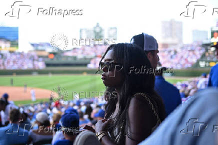 Baseball fans watch Chicago Cubs and the Milwaukee Brewers at Wrigley Field in Chicago, USA