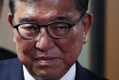 Japan's Prime Minister Ishiba speaks to media after meeting with the party's executives at the LDP headquarters in Tokyo