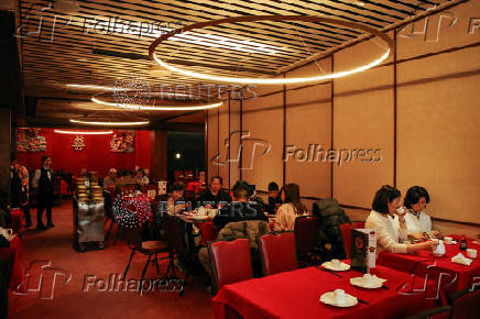 Diners eat lunch at Jing Fong, a dim sum restaurant in the Chinatown neighborhood of Manhattan in New York City