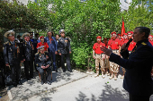 World War Two veteran Nikolai Golubtsov receives congratulations on the upcoming Victory Day in Sevastopol
