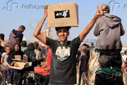Palestinians seeking aid gather near an aid distribution site run by the U.S.-backed Gaza Humanitarian Foundation, in Rafah