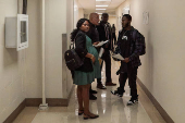 A Haitian migrant is detained by U.S. Immigration and Customs Enforcement agents at US Immigration Court in New York City