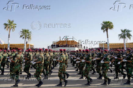 FILE PHOTO: Iraqi PM Mustafa al-Kadhimi attends a military parade for the members of PMF in Diyala province