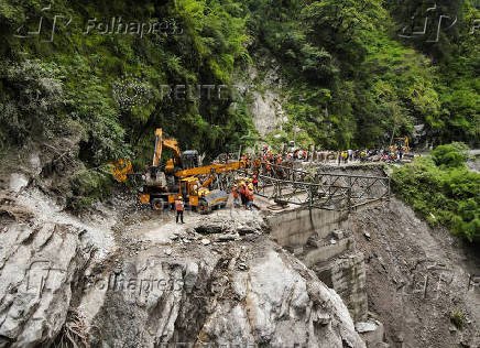 A drone view of BRO and SDRF officials attempting to build a makeshift bridge in Gangnani
