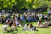 People enjoy the sunny weather in London