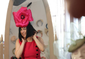 Milliner Merve Bayindir wears one of her hat creations as she speaks to Reuters ahead of the Ascot horse racing festival, in London