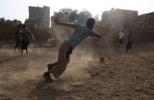 Yemeni youths play soccer in Sana'a