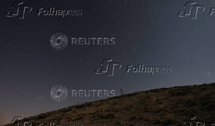 A meteor streaks across the sky, in Qamishli