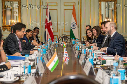 Britain's Secretary of State for Business and Trade Jonathan Reynolds welcomes Indian Minister of Commerce and Industry Piyush Goyal for trade talks, in London