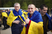 Ukrainian POWs are seen after a swap at an unknown location in Ukraine