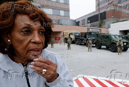 California National Guard troops stand outside the Edward R. Roybal federal building, in Los Angeles