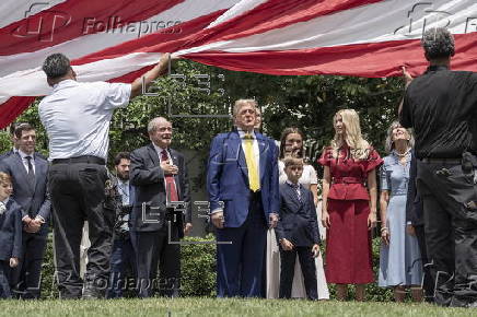 A new flagpole is installed on the South Lawn of the White House