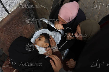 Funeral of Palestinians killed on Sunday by Israeli fire while seeking aid in northern Gaza, according to Gaza's health ministry, at Al-Shifa Hospital
