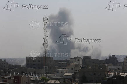 Smoke rises following an Israeli strike, in Khan Younis
