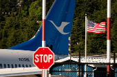 A Boeing jet intended for use by a Chinese airline returns to Boeing Field, in Seattle, Washington
