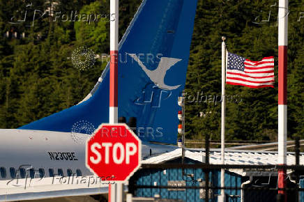 A Boeing jet intended for use by a Chinese airline returns to Boeing Field, in Seattle, Washington