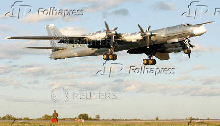 FILE PHOTO: A Russian TU-95 bomber, or Bear, lands at a military airbase in Engels