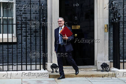 British Prime Minister Keir Starmer walks outside 10 Downing Street in London