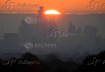 FILE PHOTO: Sunrise over City of London financial district, London