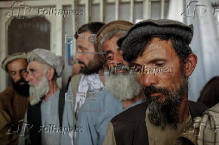 Afghans register for a labor program to work in Qatar