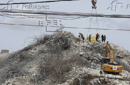 Rescuers search for survivors after signs of life detected under Bangkok building rubble
