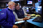 Traders work on the floor of the NYSE in New York