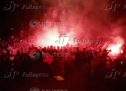 Champions League - Fans celebrate after Paris St Germain qualifies for the final