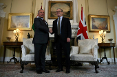 Britain's Prime Minister Keir Starmer and Jordan's King Abdullah shake hands ahead of a meeting inside 10 Downing Street, in London