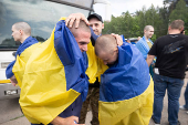 Ukrainian POWs are seen after a swap at an unknown location in Ukraine